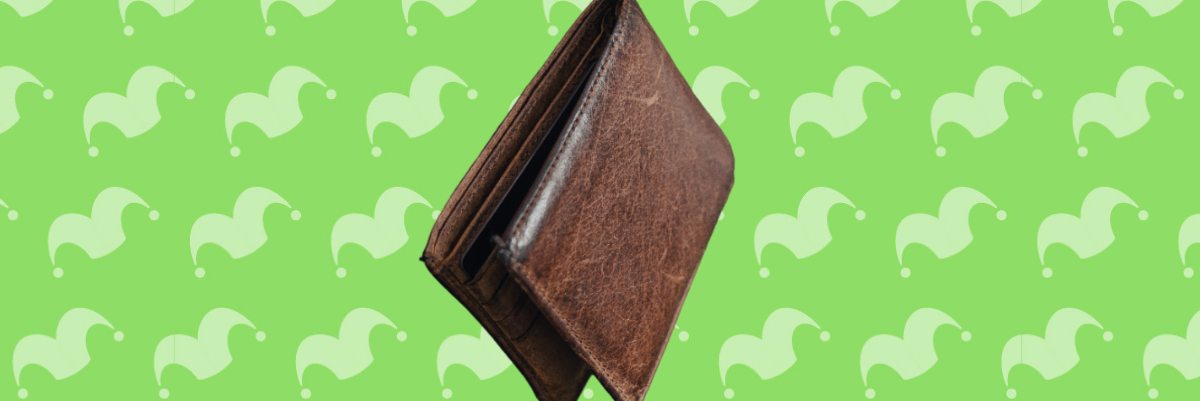 A wallet on top of a green background