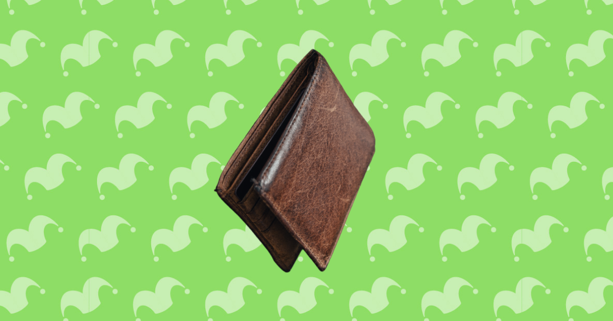 A wallet on top of a green background
