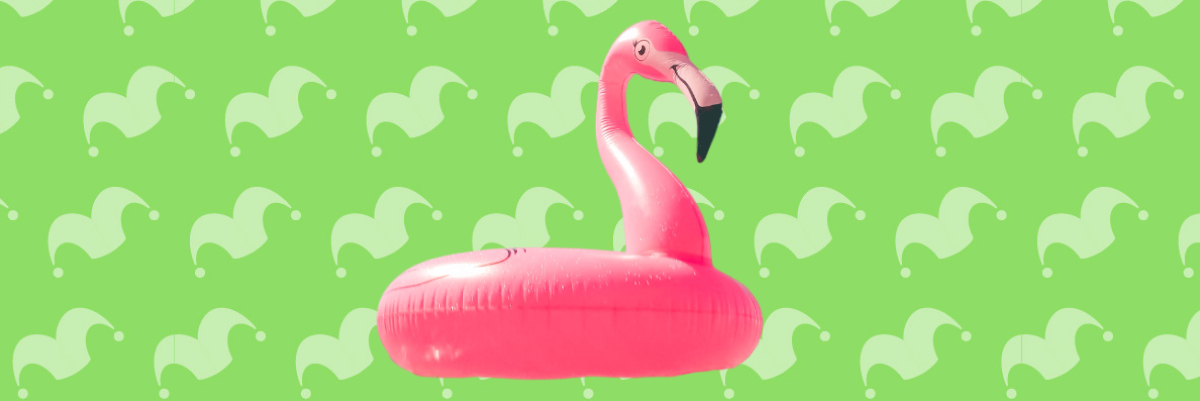 An inflatable flamingo over a green background