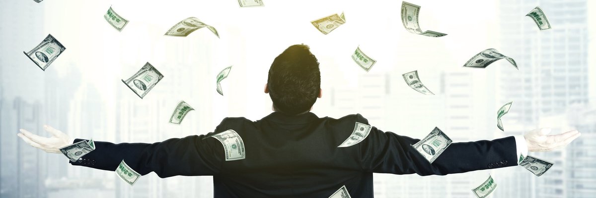 Business Man Spreading Arms As Money Rains On Him