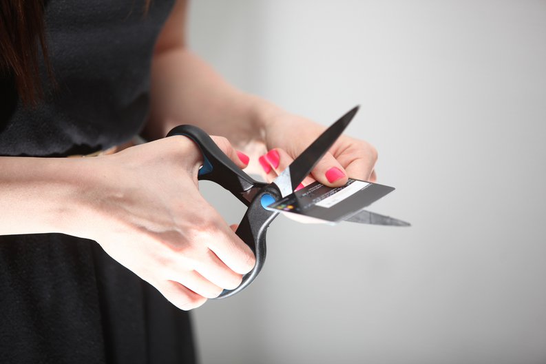 Woman Cutting Credit Card