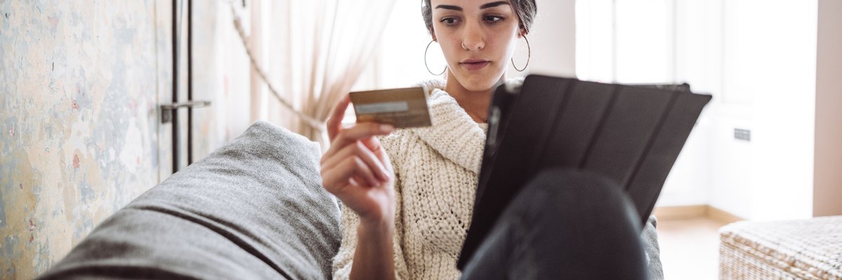 Woman Looking at Her Credit Card