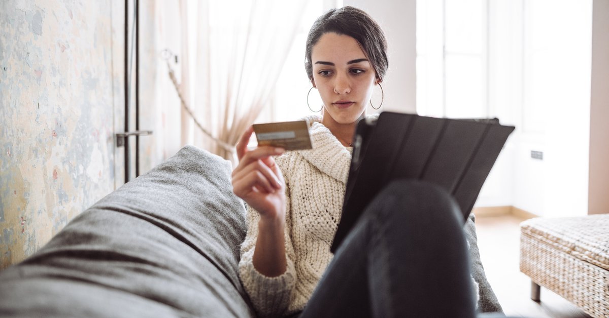 Woman Looking at Her Credit Card