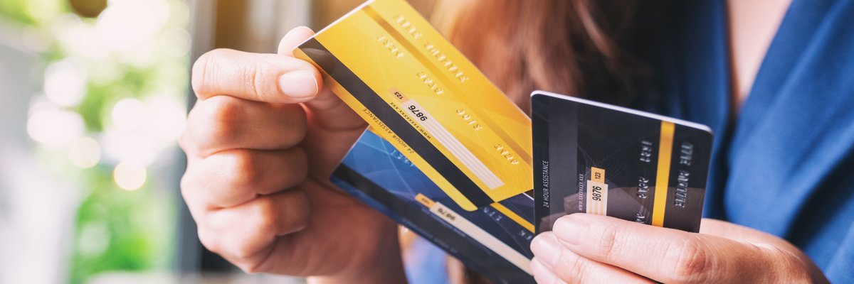 Woman Looking At Credit Cards