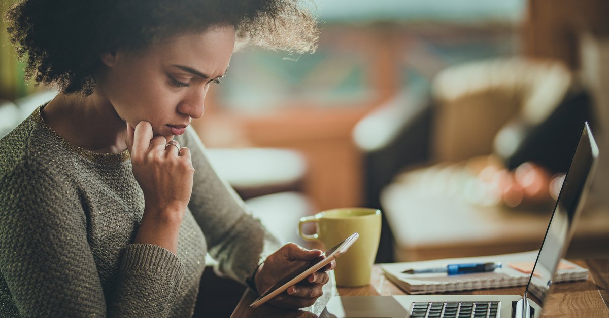 Woman Looking Concerned At Phone