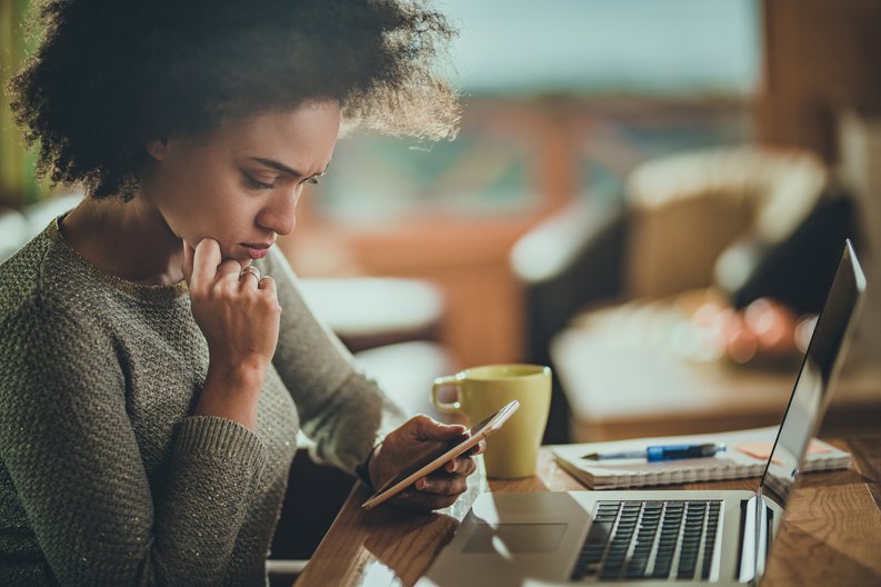 Woman Looking Concerned At Phone