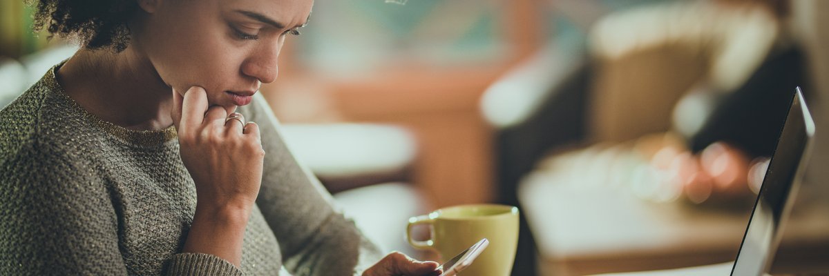 Woman Looking Concerned At Phone
