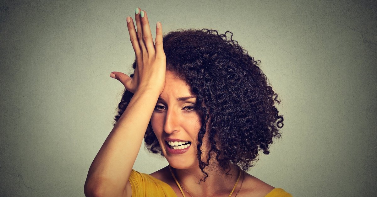Woman Slapping Forehead With Regret