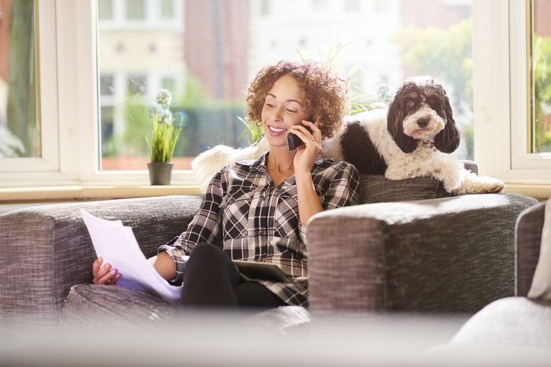 Woman With Dog Talking On Phone