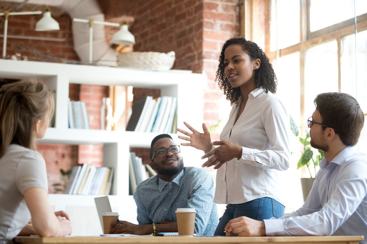 A woman leading a meeting in an office.