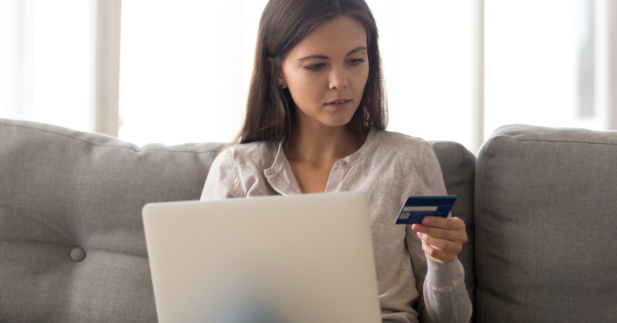 Woman with credit card laptop