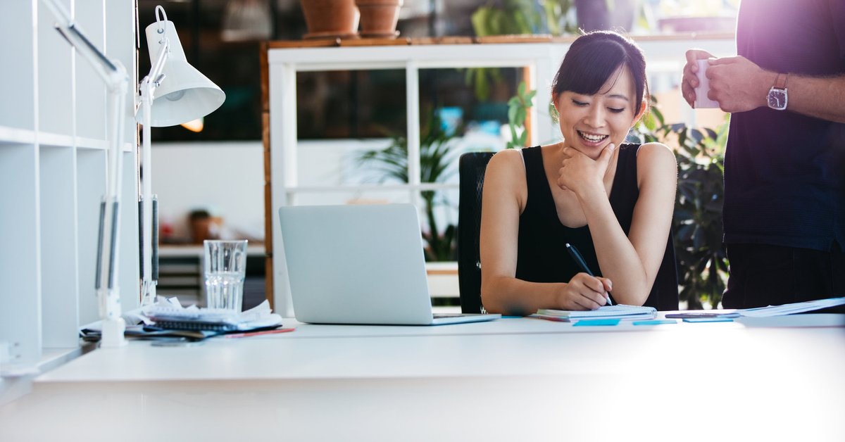 Smiling woman working in a bright office.