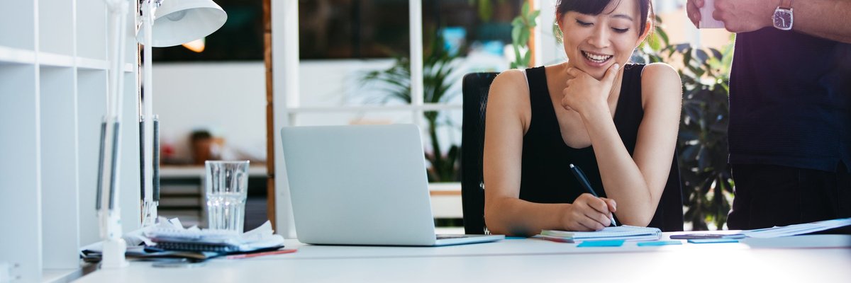 Smiling woman working in a bright office.