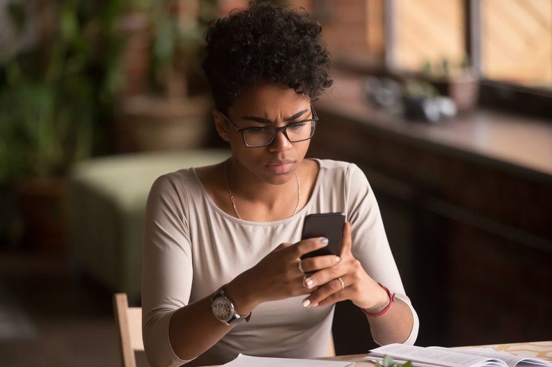 Worried Lady Looking At Phone