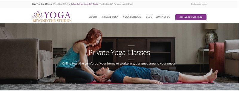 A yoga instructor working with a client.