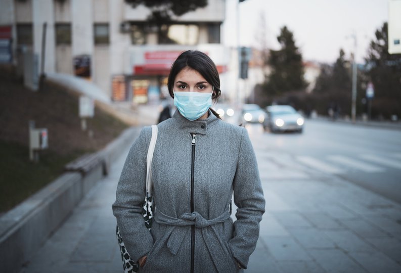 Young Woman in a Mask