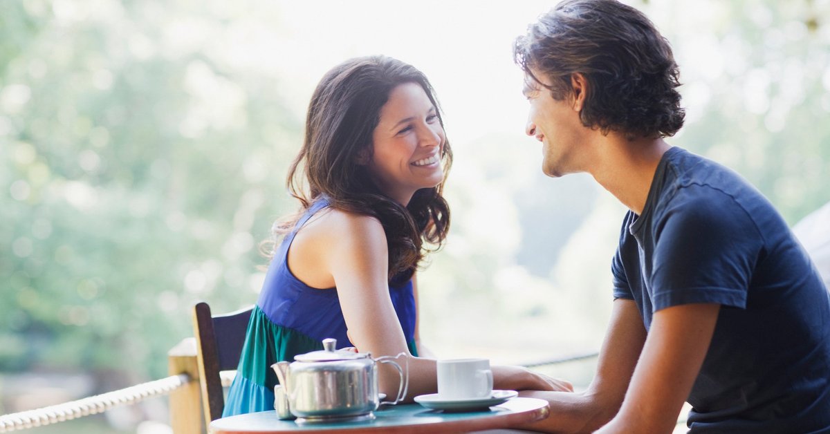 Young couple look at each other with affection
