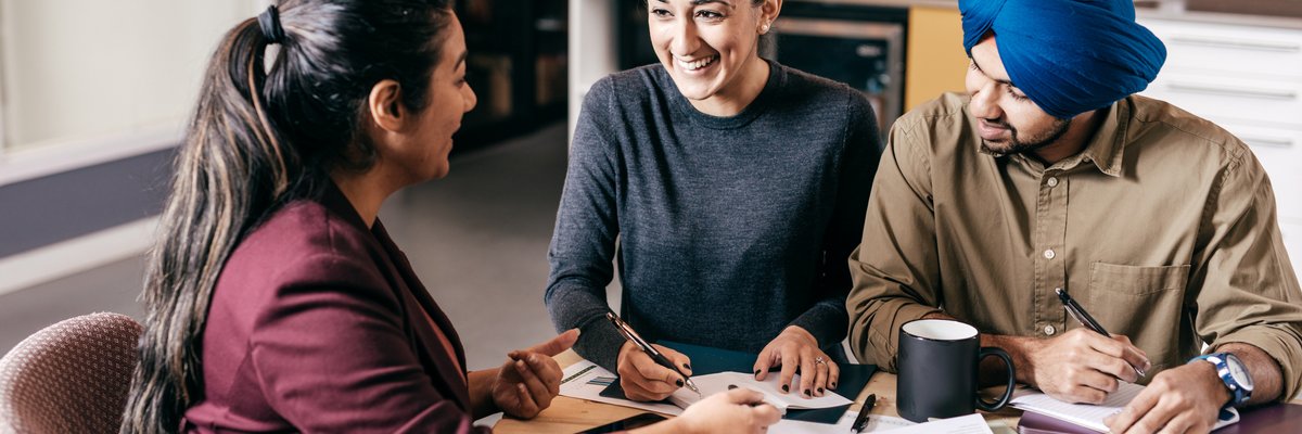 Young couple meets with an agent.