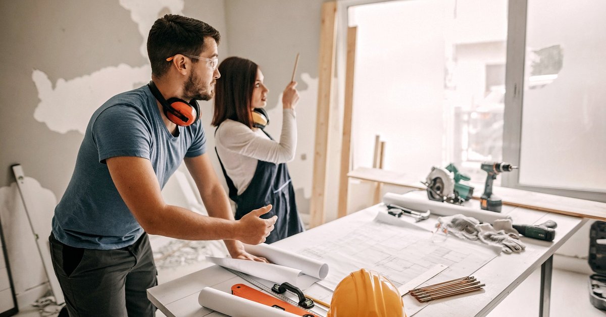Young couple working together on a home remodel project.