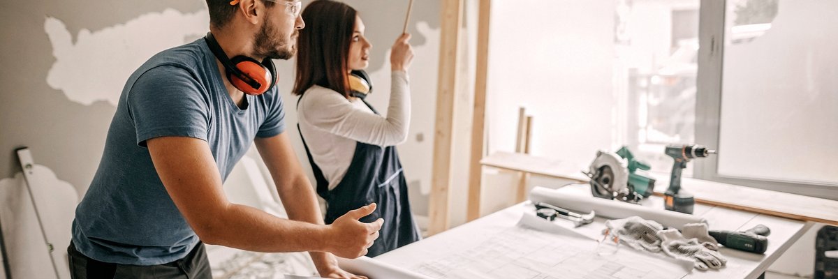 Young couple working together on a home remodel project.