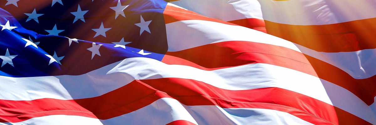 An up-close shot of American flag moving in the wind.