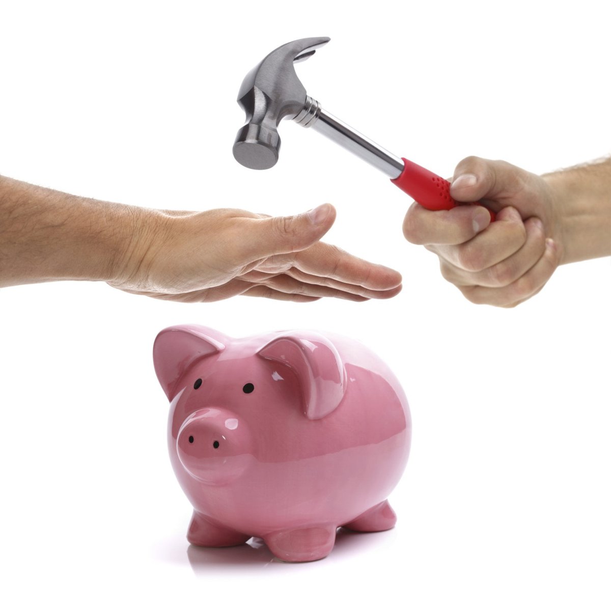 A hand preventing a hammer from breaking a piggy bank.