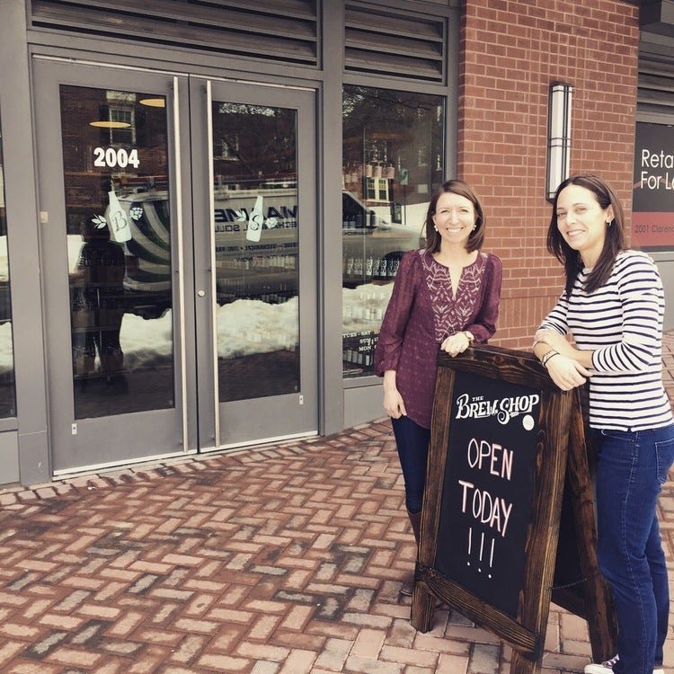 Two founders stand in front of their Virginia-based beer shop