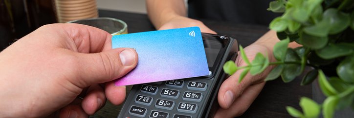 Someone pays with a contactless credit card.
