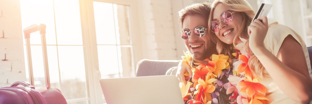 couple with leis and sunglasses