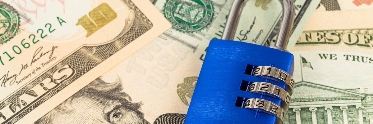Padlock on top of cash