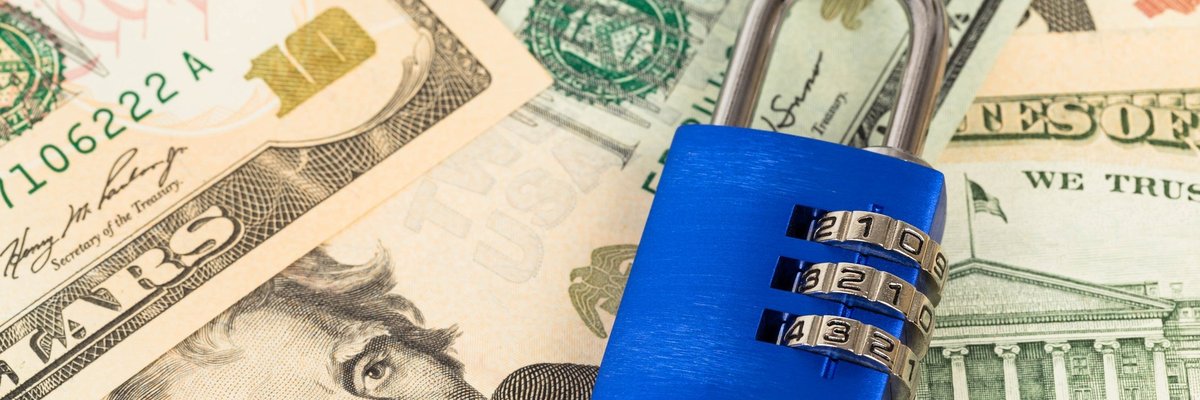 Padlock on top of cash