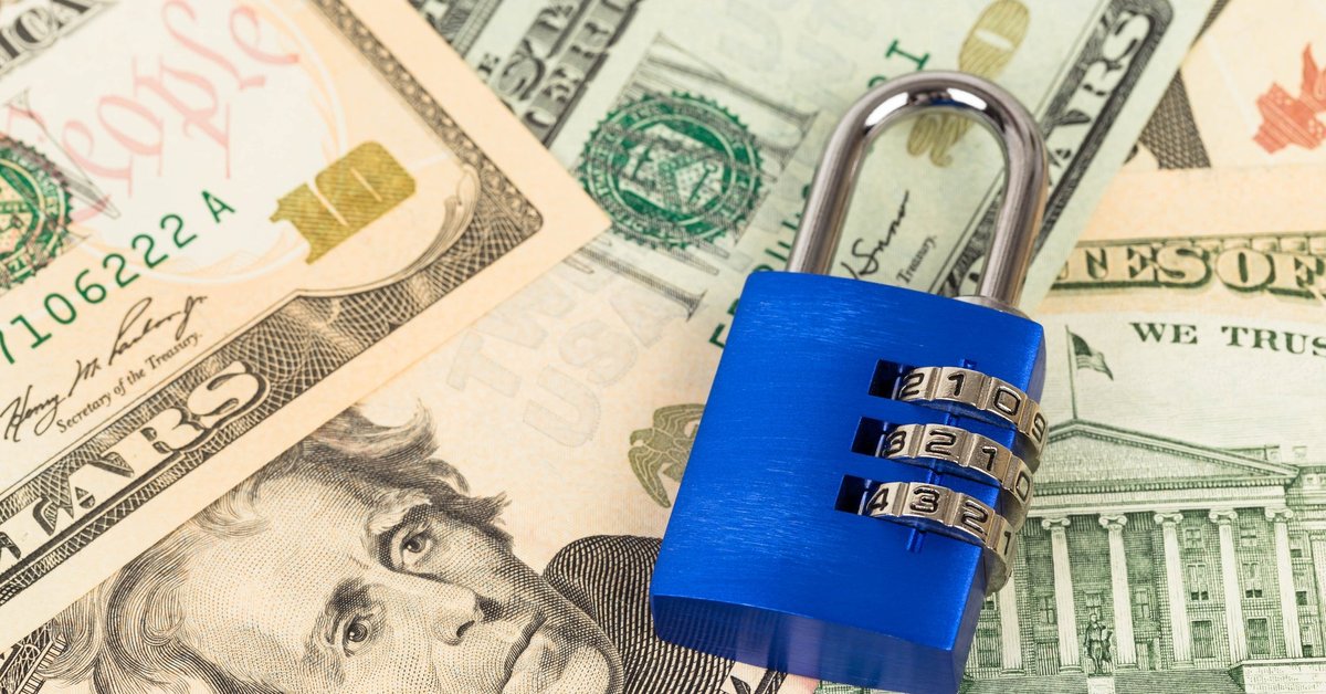 Padlock on top of cash
