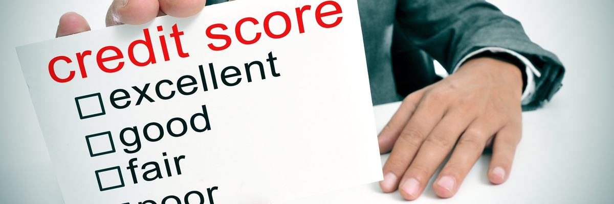 Man holding credit score scorecard.