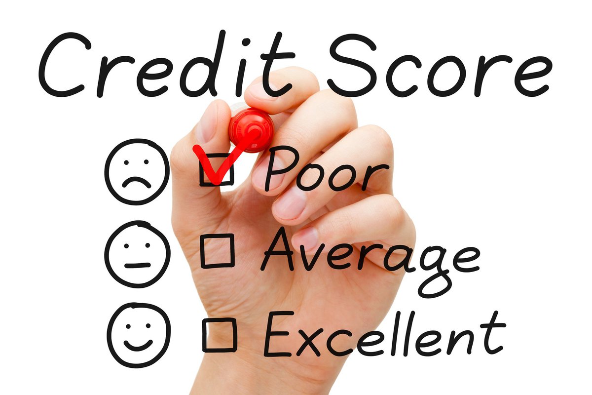 Credit score chart with hand checking "Poor"