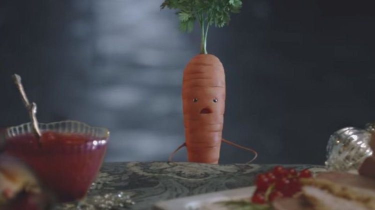 A picture of Kevin the Carrot, Aldi’s fictional children’s character, sitting at the dinner table.