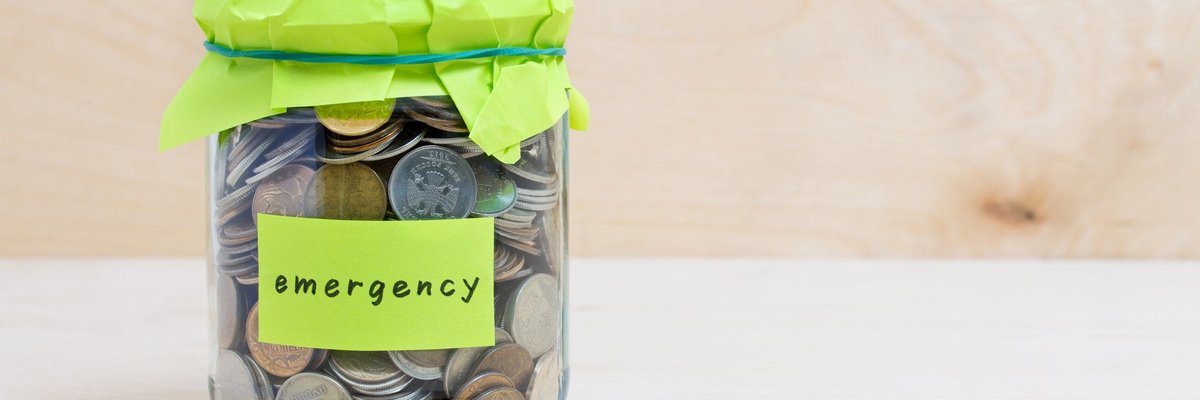 Jar of coins with "emergency" label