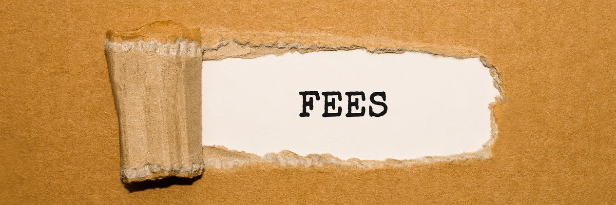 A piece of cardboard torn to reveal the word FEES.