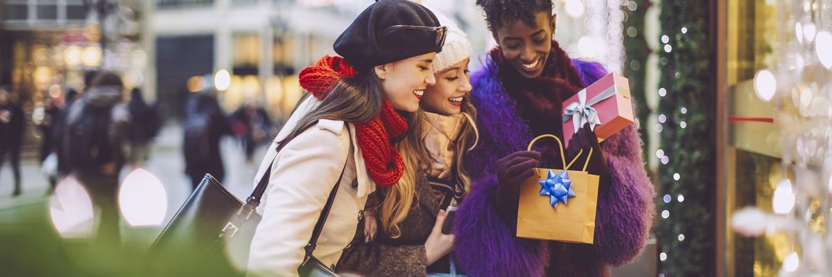 Friends shopping in the city for holiday gifts.