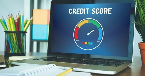 A computer with a graph indicating a good credit score.