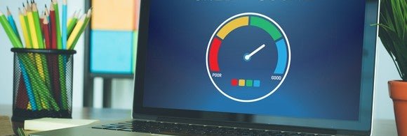 A computer with a graph indicating a good credit score.