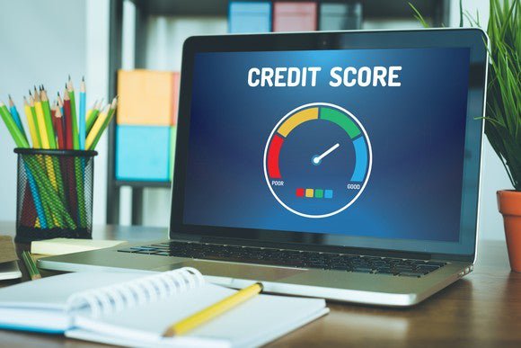 A computer with a graph indicating a good credit score.