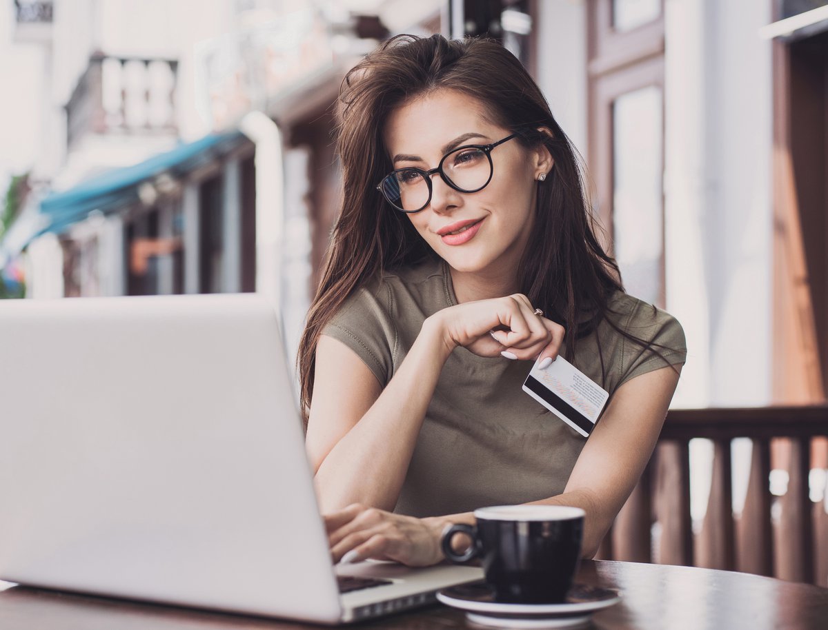Girl holding credit card