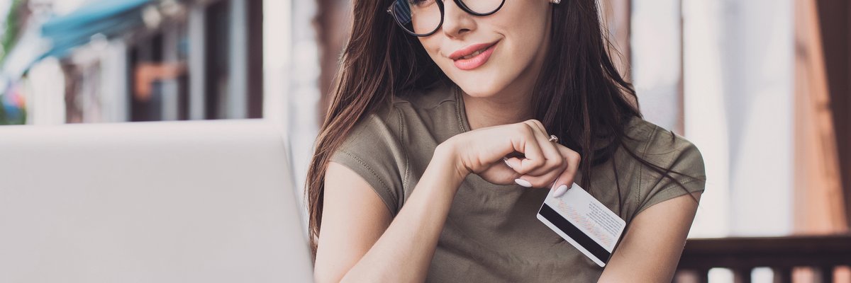 Girl holding credit card
