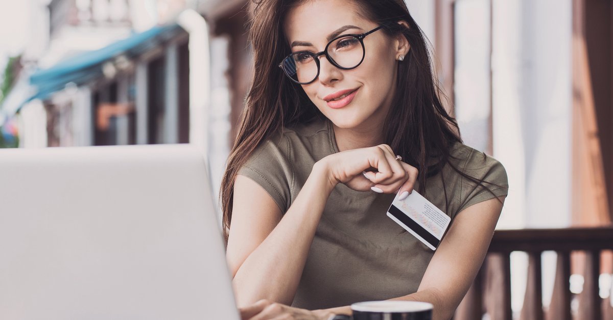 Girl holding credit card
