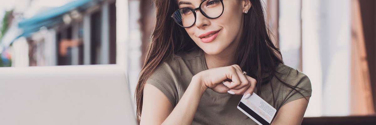 Girl holding credit card