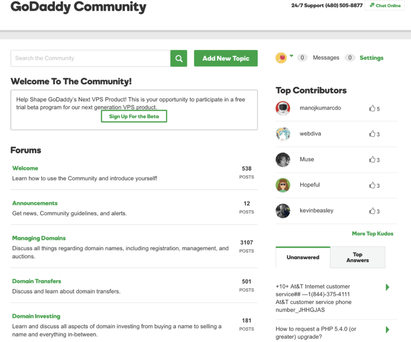The GoDaddy community forums for troubleshooting issues, showing a list of topics and contributors.