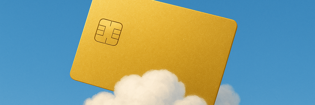 A gold credit card on top of a cloud.