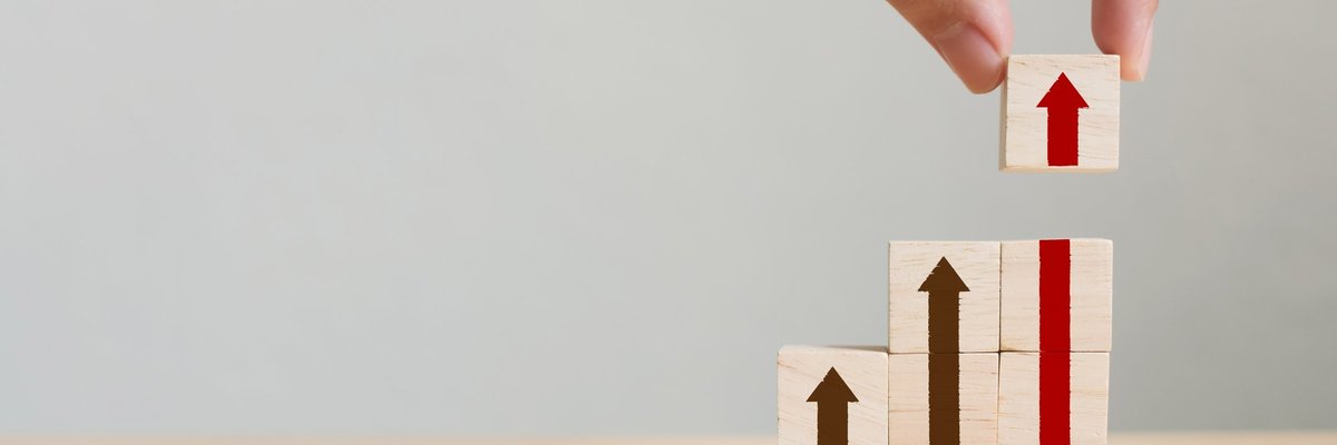 Stacks of blocks with arrows showing growth