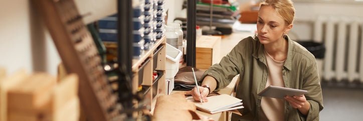 A woman working at her business.
