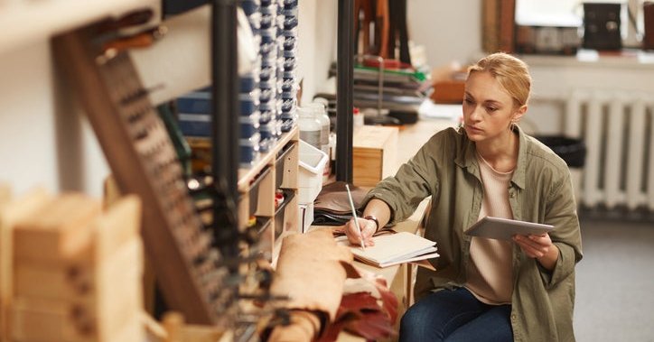 A woman working at her business.
